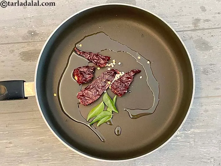 Step 14 – Add&nbsp;<meta charset="UTF-8" />4 to 5&nbsp;<a href="glossary-curry-leaves-kadi-patta-kadipatta-388i">curry leaves (kadi patta)</a>.