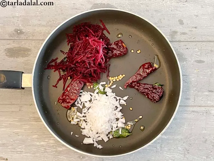 Step 17 – Add&nbsp;<meta charset="UTF-8" />1/4 cup&nbsp;<a href="glossary-grated-coconut-852i">grated coconut</a>.