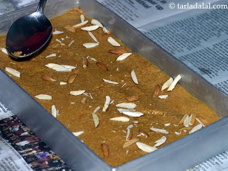 Step 12 – Sprinkle the almond slivers evenly over it and press it lightly with the help of …