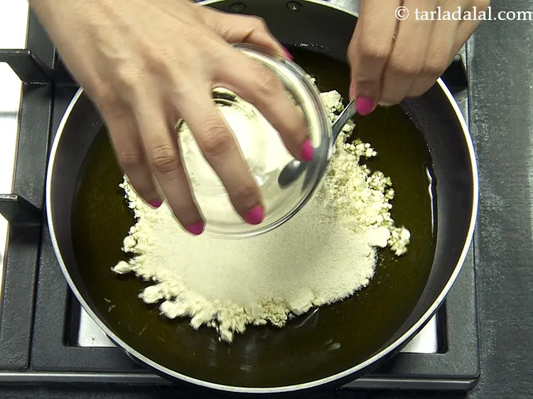 Step 5 – Add rava. Semolina is used to give a nice coarse texture to the besan barfi. …