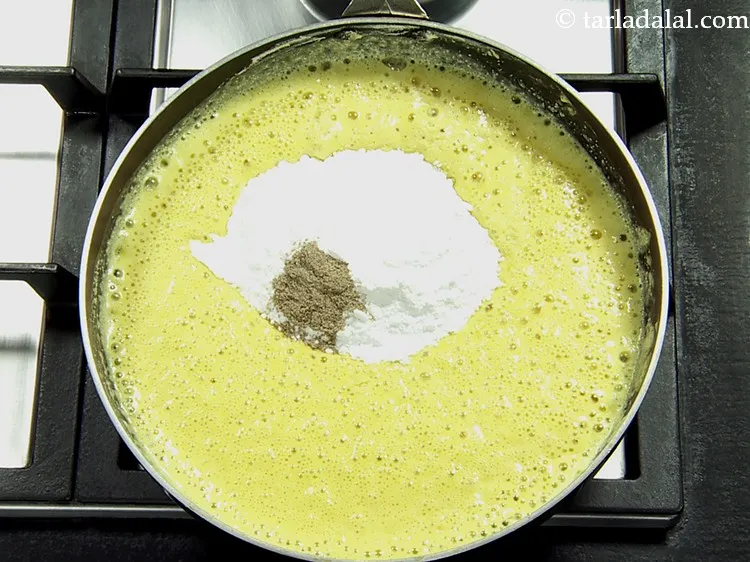 Step 8 – Add cardamom powder. Elaichi gives a pleasant flavour and aroma to the besan barfi.