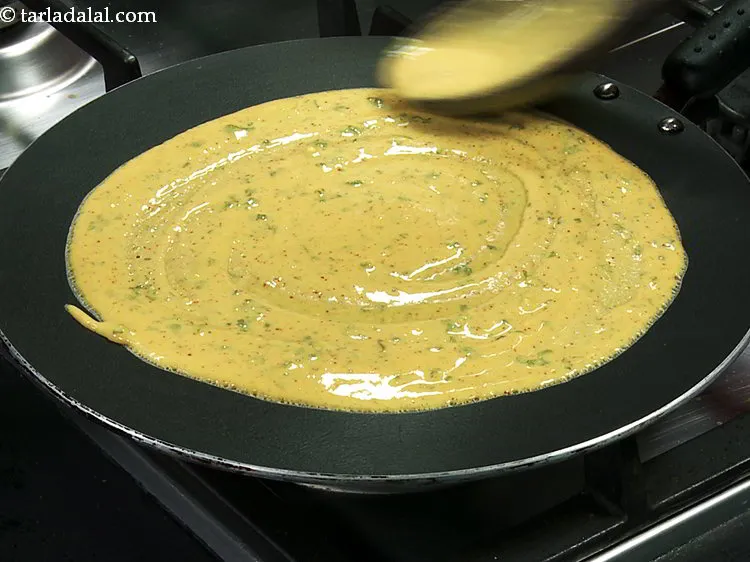 Step 25 – Spread it in circular motion, making it look like a dosa.