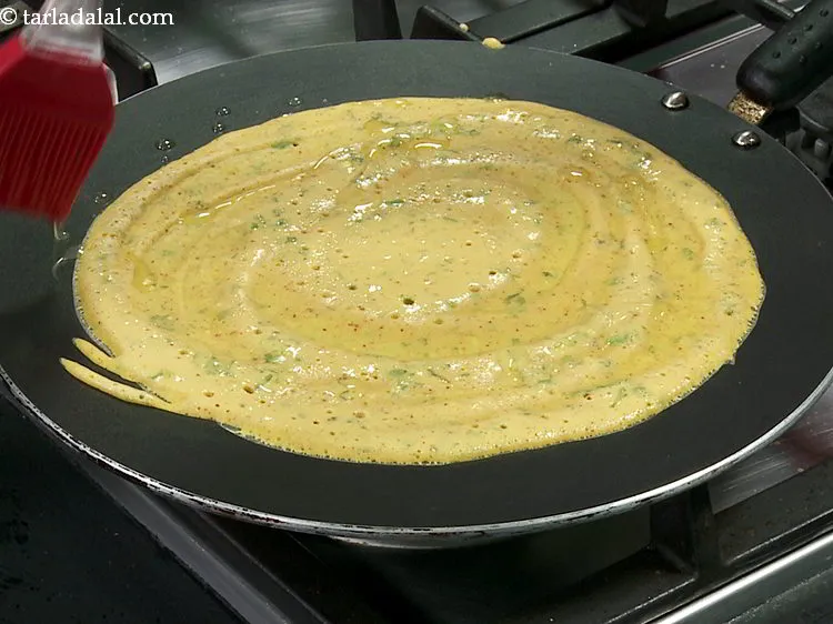 Step 13 – Smear 1 tsp of oil evenly over it and along the edges.