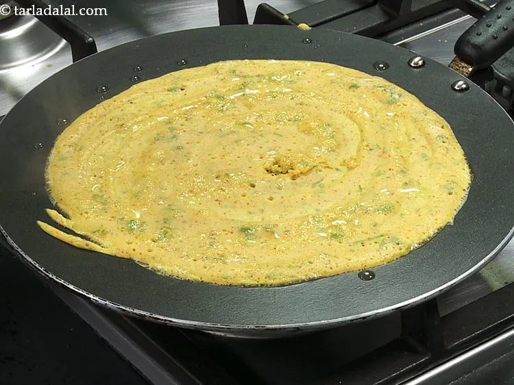 Step 14 – Cook on a medium flame till the vegetarian omelette turns golden brown in color and …