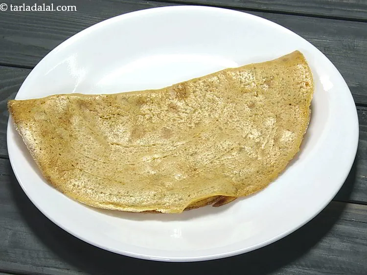 Step 18 – Carefully remove <strong>besan chilla</strong> a plate.