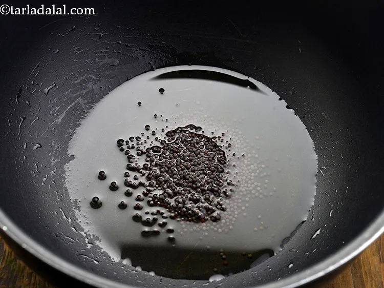 Step 15 – Once the oil is hot, add mustard seeds.