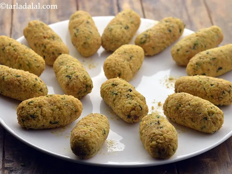 Step 13 – Shape each portion into a cylindrical roll approx. 75 mm. (3") lengthwise. Keep aside.