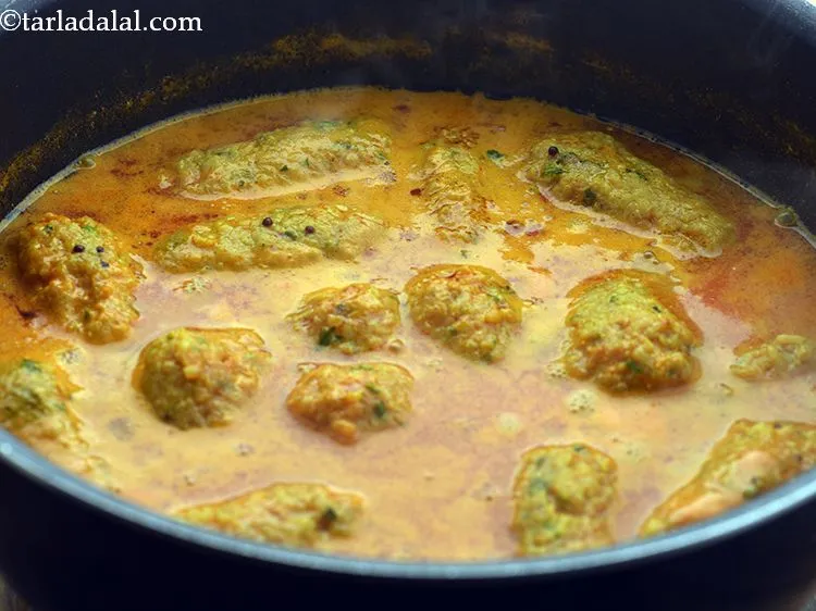 Step 25 – Simmer for 7-8 minutes till the muthias are firm and cooked, while stirring once very …