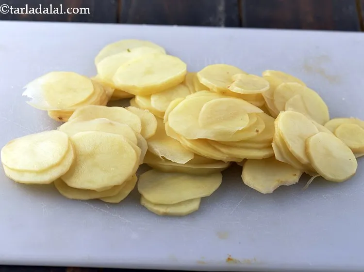 Step 4 – Slice the potatoes thinly with the help of a knife. If you have a mandolin …