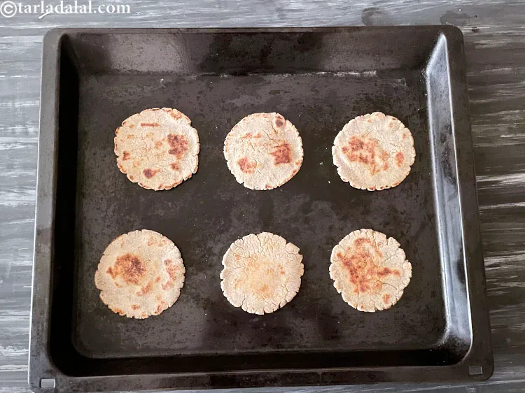 Step 46 – To make <strong>baked bhakri pizza</strong>, you are going to use the bhakri and pizza sauce …