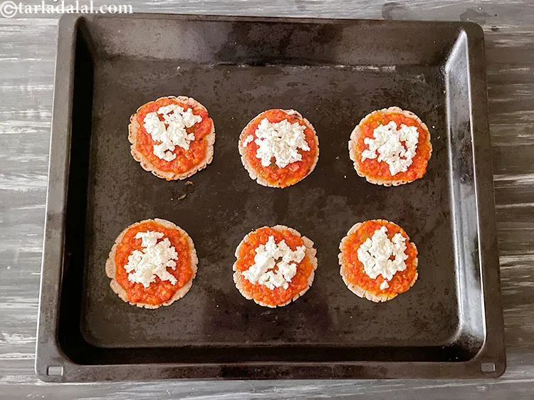 Step 49 – Top with 1 1/2 tablespoons of paneer over each bhakri.