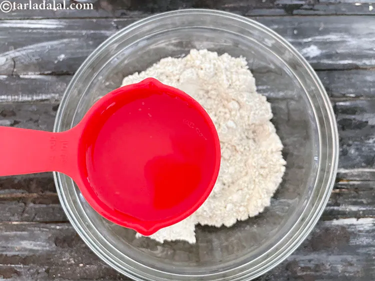 Step 31 – Add water gradually&nbsp;to make a firm dough. The dough should not be soft.