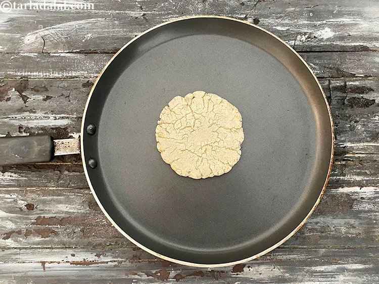 Step 38 – Cook bhakri&nbsp;on a slow flame on one side.