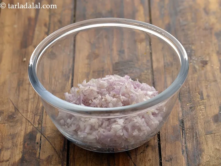 Step 2 – To prepare the stuffing for <strong>Maharashtrian stuffed brinjals</strong>, in a deep bowl take 1 cup …