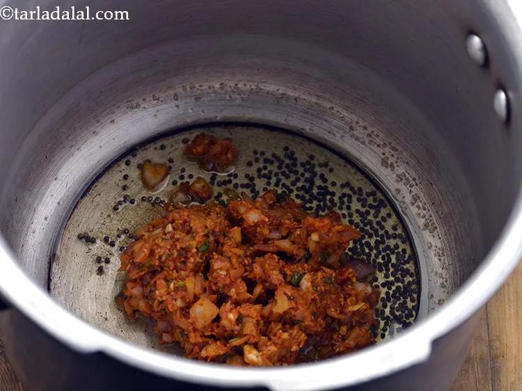 Step 21 – When the seeds crackle, add the remaining masala mixture.