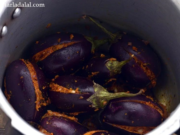 Step 23 – Add the stuffed brinjals.