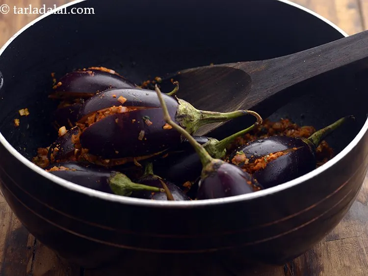 Step 23 – Add the stuffed brinjals.