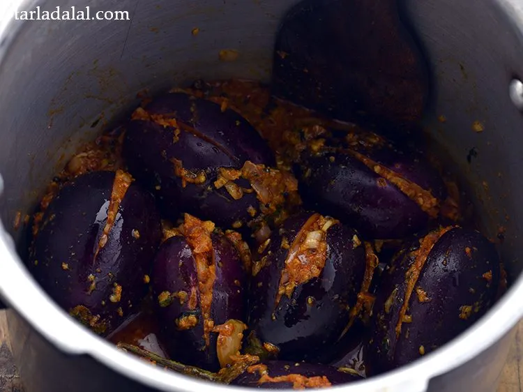 Step 25 – Mix gently and pressure cook on a high flame for 3 whistles. If you mix …