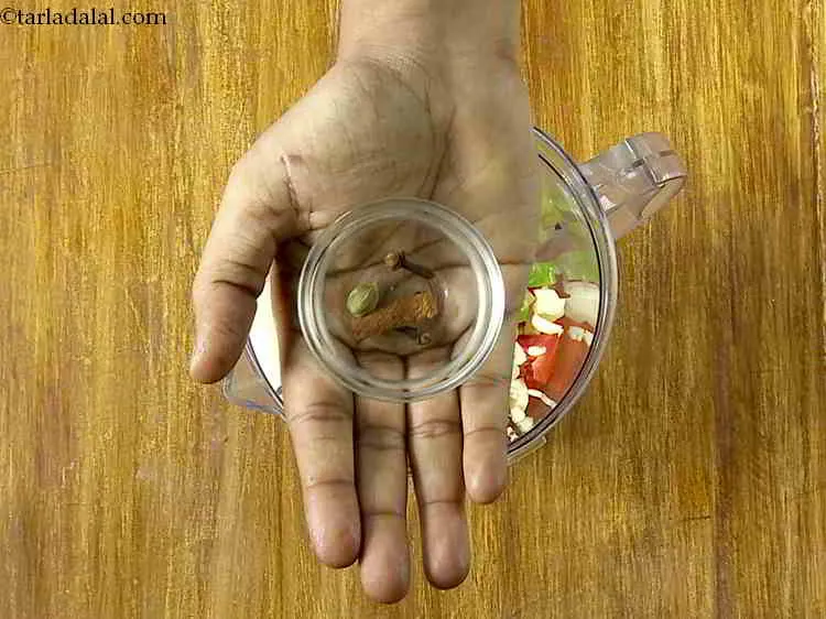 Step 9 – Add cloves, cardamom and one small stick cinnamon.