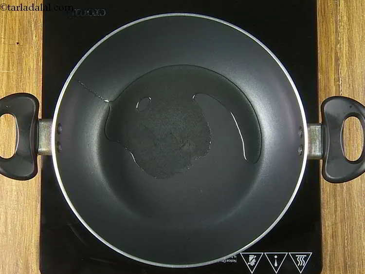 Step 11 – Heat 1 tbsp of oil in a deep non-stick pan.