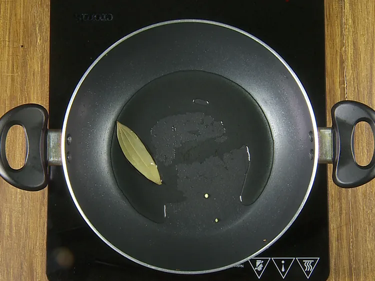 Step 15 – Once hot, add the bayleaf.
