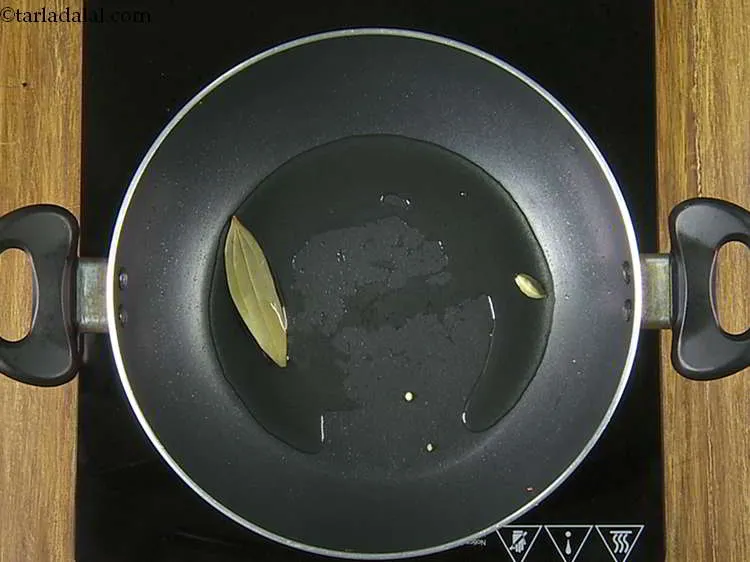 Step 16 – Add the cardamom and saut&eacute; on a medium flame for a few seconds.