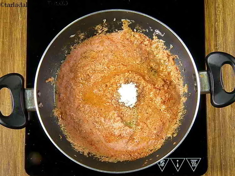 Step 24 – Add the sugar and salt. The sugar balances the tang from tomatoes.