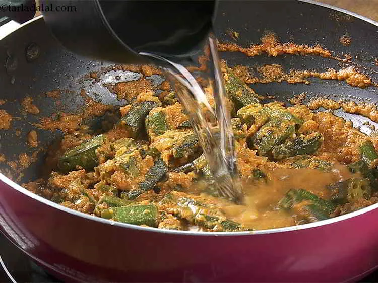 Step 28 – Add &frac34; cup of water to&nbsp;<strong>&nbsp;Bhindi Masala Gravy</strong>.