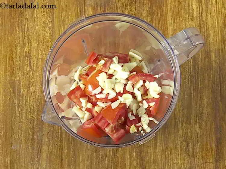 Step 7 – Add the chopped ginger, roughly chopped garlic and roughly chopped green chillies.