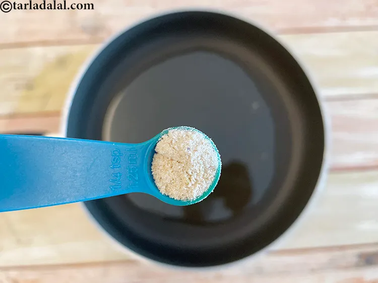 स्टेप 21 – १ टी-स्पून <a href=""https://www.tarladalal.com/glossary-asafoetida-hing-hindi-113i"">हींग</a> डालें।