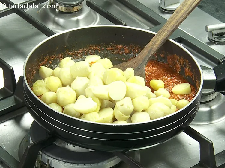 Step 22 – Add 2 cups&nbsp;<a href="https://www.tarladalal.com/glossary-boiled-baby-potato-halves-2643i">boiled baby potato halves</a>.