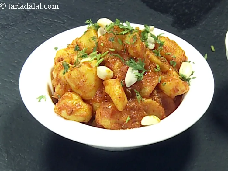 Step 26 – Also garnish with 2 tbsp&nbsp;<a href="https://www.tarladalal.com/glossary-chopped-coriander-783i">chopped coriander (dhania)</a>.