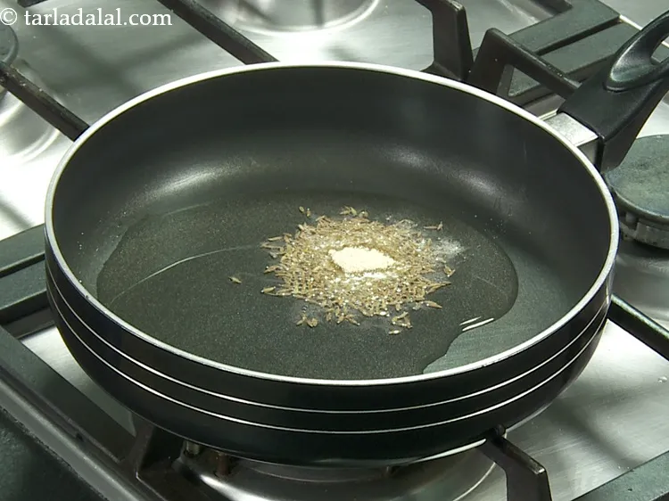 Step 9 – When the seeds crackle, add 1/4 tsp&nbsp;<a href="https://www.tarladalal.com/glossary-asafoetida-hing-113i">asafoetida (hing)</a>.