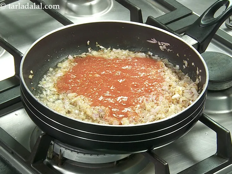 Step 15 – Add 3/4 cup&nbsp;<a href="https://www.tarladalal.com/fresh-tomato-pulp-38652r">fresh tomato pulp</a>.