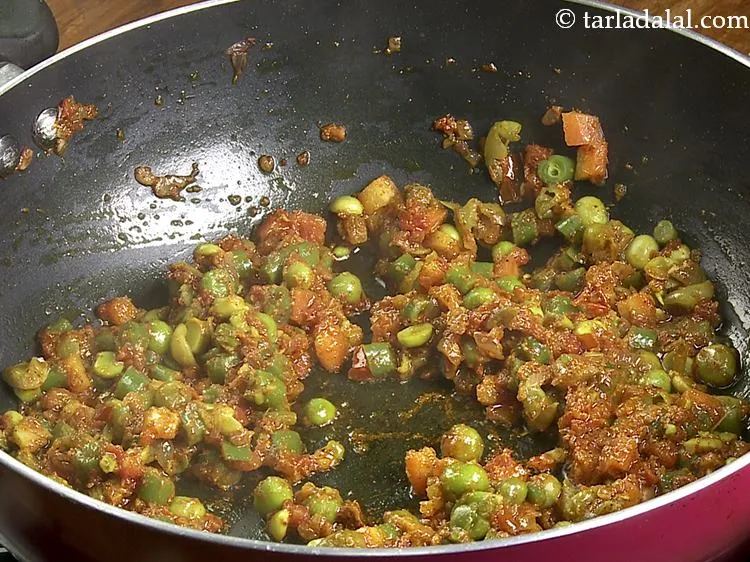 Step 13 – Mix well and cook on a medium flame for 2 minutes, while mashing it with …