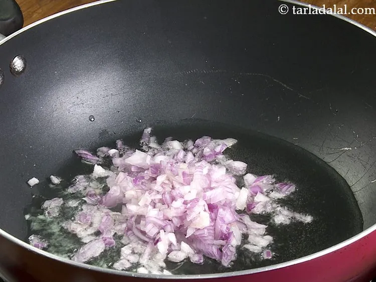 Step 2 – Once the oil is hot, add onions.