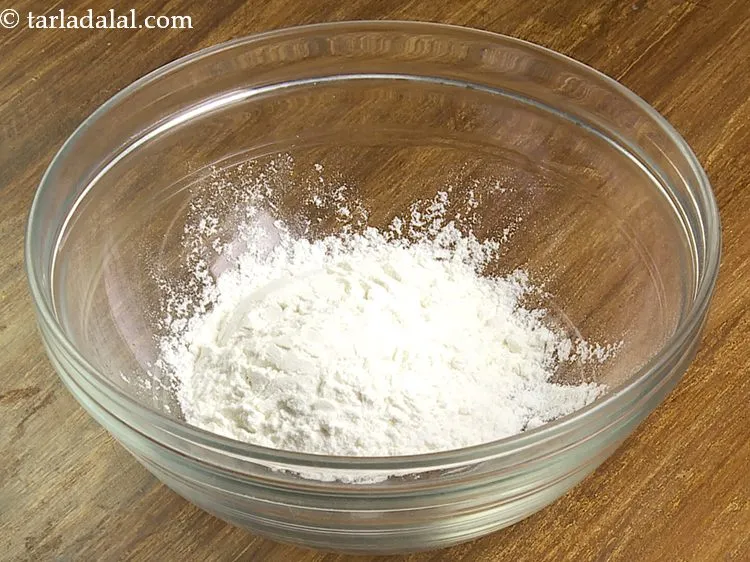 Step 23 – For the coating of crispy <strong>veg biryani balls</strong>, we will be using a plain-flour water …