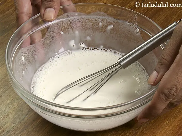 Step 25 – Add &frac12; cup water and mix well using a whisk. Keep aside.