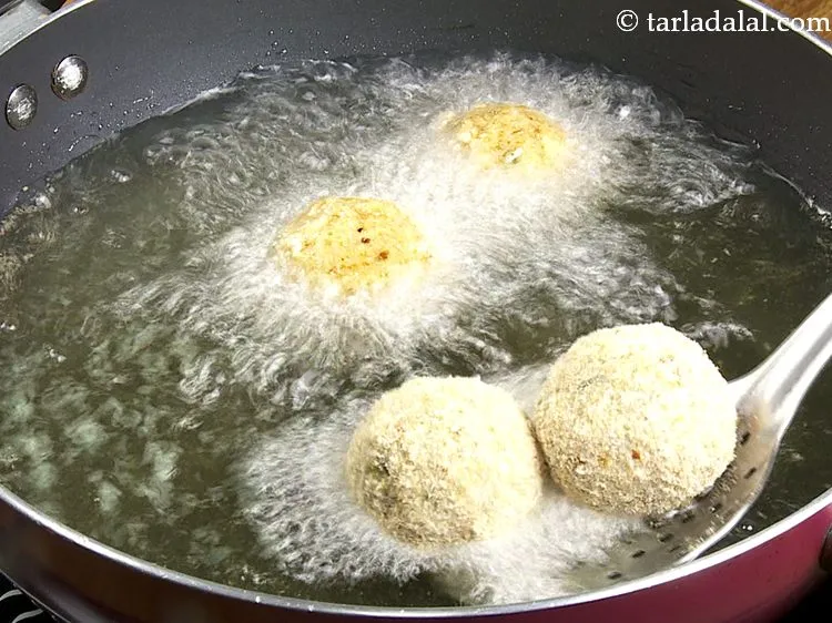 Step 35 – For frying the Biryani Arancini balls, heat the oil in a deep non-stick pan and …