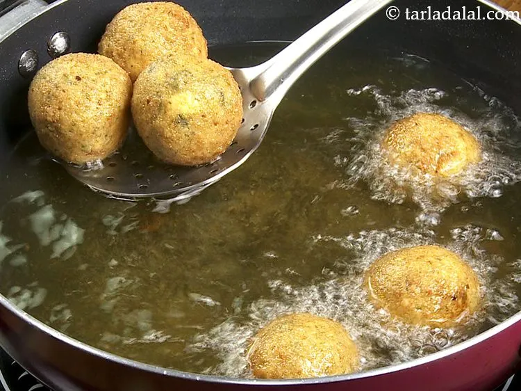 Step 36 – Deep-fry <strong>biryani balls</strong> on a medium flame till they turn golden brown in color from …
