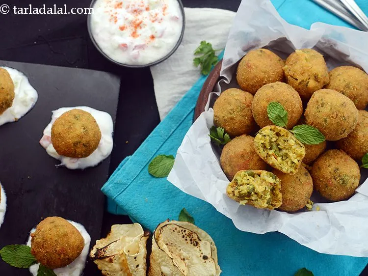 Step 38 – Serve <strong>Biryani arancini</strong> immediately with <a href="https://www.tarladalal.com/Tomato-Onion-Raita-41080r" target="_blank">tomato onion raita</a> and roasted papad. If you …