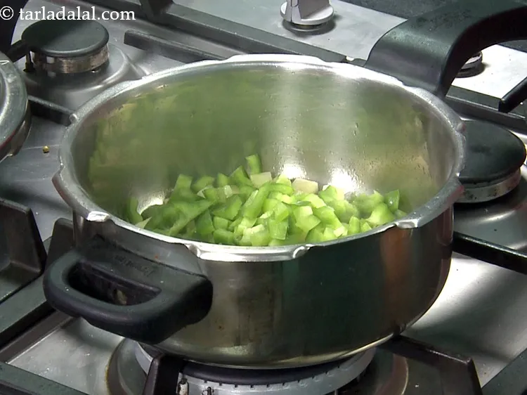 Step 29 – Add 1/2 cup&nbsp;chopped&nbsp;<a href="https://www.tarladalal.com/glossary-capsicum-shimla-mirch-bell-pepper-163i">capsicum</a>.