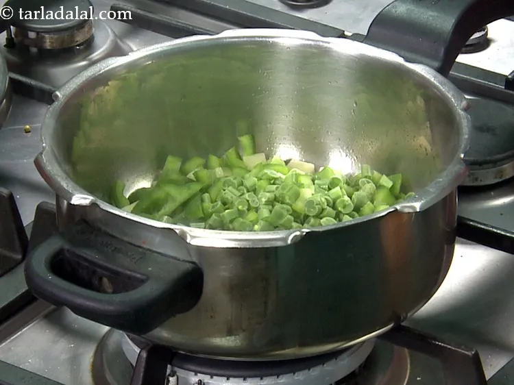 Step 30 – Add&nbsp;1/4 cup&nbsp;<a href="https://www.tarladalal.com/glossary-chopped-french-beans-797i">chopped french beans</a>.