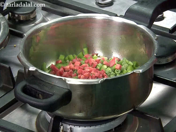 Step 31 – Add&nbsp;1/4 cup&nbsp;<a href="https://www.tarladalal.com/glossary-chopped-carrot-798i">chopped carrot</a>.