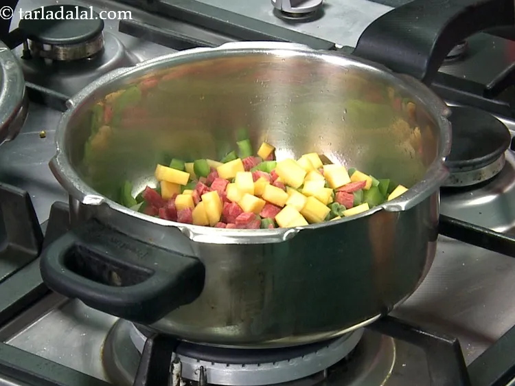 Step 32 – Add&nbsp;1/4 cup&nbsp;<a href="https://www.tarladalal.com/glossary-chopped-red-pumpkin-809i">chopped red pumpkin (bhopla / kaddu)</a>.