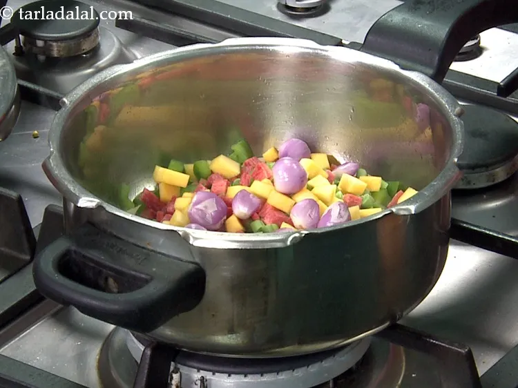 Step 33 – Add&nbsp;1/4 cup&nbsp;<a href="https://www.tarladalal.com/glossary-shallots-madras-onions-827i">shallots (madras onions)</a>.