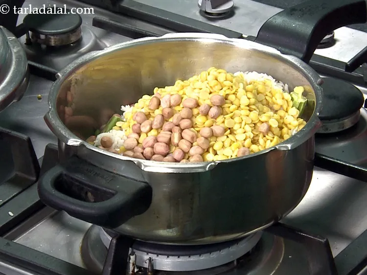 Step 37 – Add 1/4 cup&nbsp;<a href="https://www.tarladalal.com/glossary-raw-peanuts-kachi-mungfali-kachi-moongfali-847i">raw peanuts</a>.