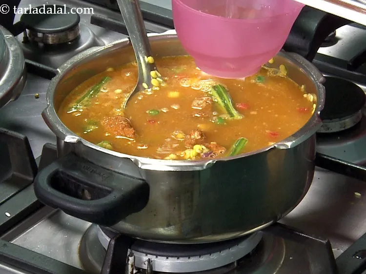 Step 43 – Add 4 cups of hot water. Use of hot water reduces the cooking time.&nbsp;