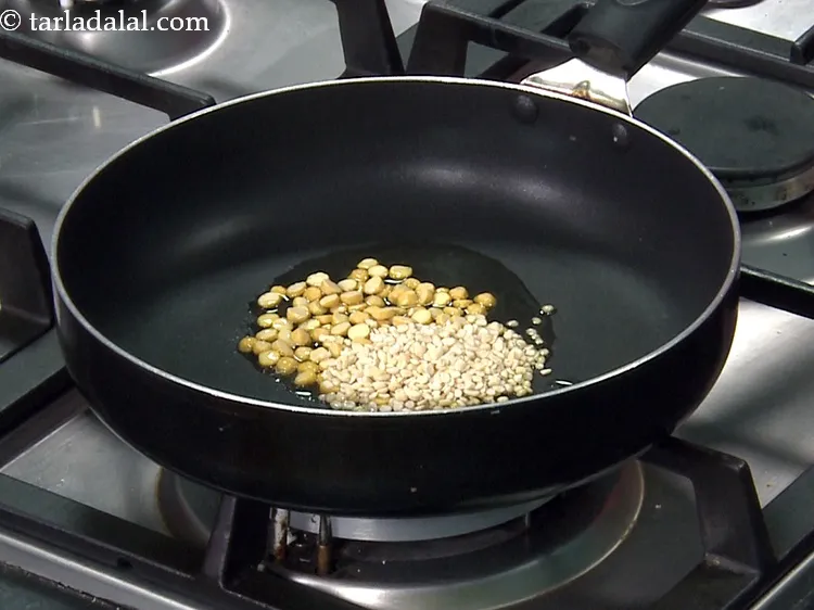Step 8 – Add 1 tbsp&nbsp;<a href="https://www.tarladalal.com/glossary-urad-dal-split-black-lentil-941i">urad dal (split black lentils)</a>.