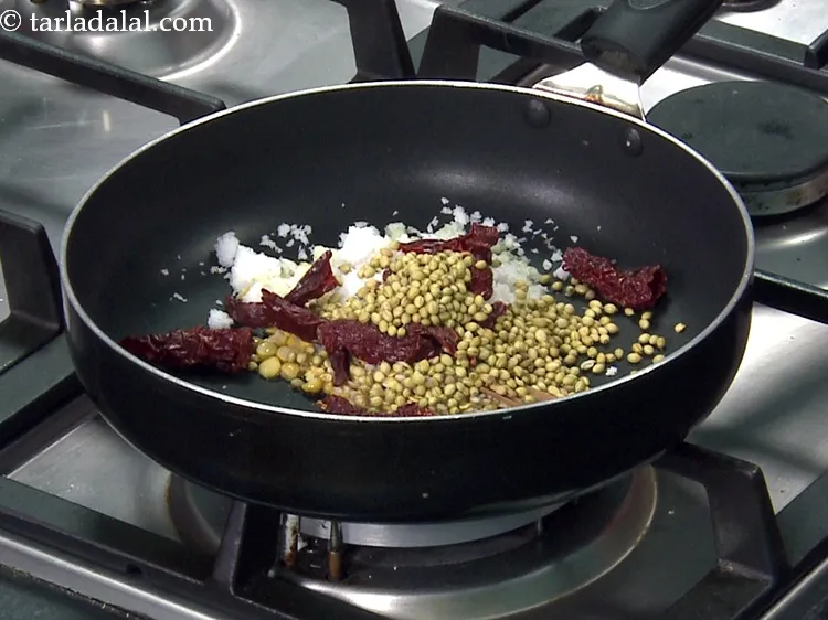 Step 12 – Add 2 tbsp&nbsp;<a href="https://www.tarladalal.com/glossary-coriander-seeds-dhania-ke-beej-dhania-seeds-akha-dhania-371i">coriander (dhania) seeds</a>.